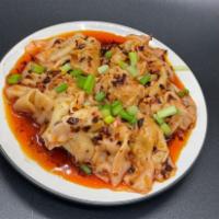 Spicy Wonton · Steamed chicken wonton in spicy Szechuan sauce, and chopped green onion.