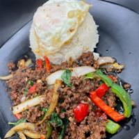 Pad Grapow beef · Minced beef, bell pepper, white onion, and basil stir-fried with sweet basil sauce served wi...