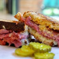 The Reuben · Corned beef, sauerkraut, provolone and Russian dressing. Include Wheat bread. 