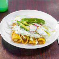 Flautas · Four fried tortilla rolls, topped with lettuce, sour cream, ground cojita cheese, and avocad...