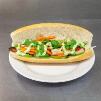 Banh Mi Sandwich · French baguette stuffed with your choice of proteins, house mayo, cucumber, carrot and daiko...