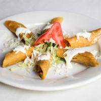 Flautas  · Corn tortillas stuffed with shredded chicken and onions deep fried to a crispy golden crust ...