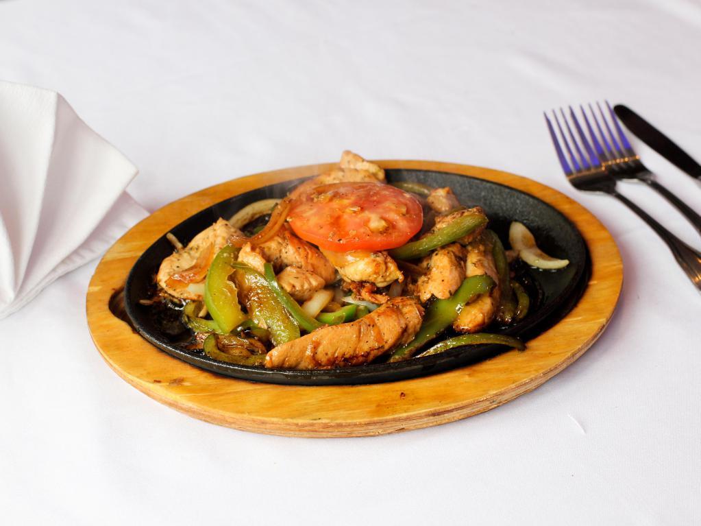 Chicken Fajita · Marinated sizzling strips of chicken topped with sauteed onions, peppers and mushrooms served with warm flour tortillas, pico de gallo, guacamole and sour cream.