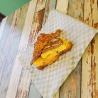 Egg, Sausage and Cheese Sandwich · Homemade croissant with chipotle mayo, egg, pork sausage patty and cheddar cheese, along wit...