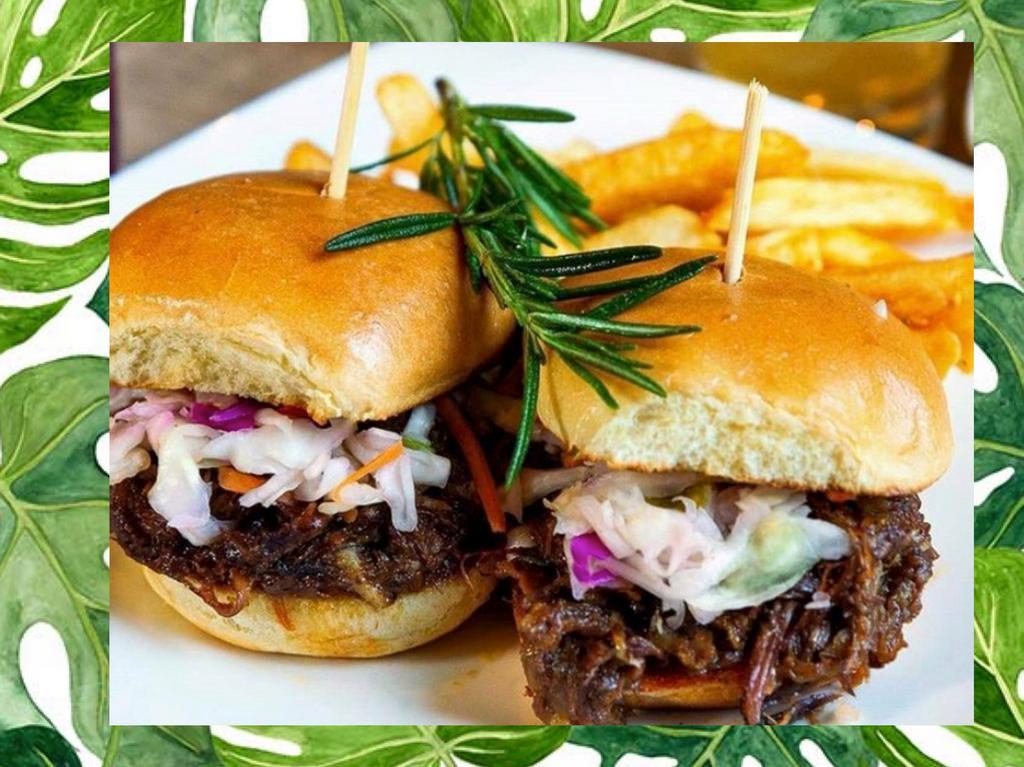 Oxtail Sliders · oven braised oxtails topped with Cole slaw on toasted slider buns