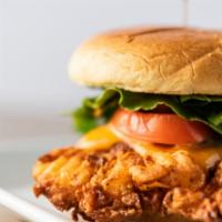 Crispy Chicken Sandwich · Buttermilk fried chicken breast on a freshly toasted bun. Served with lettuce, tomato, and p...