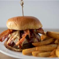 Black Jack Burger · Blackened Burger topped with Pepper Jack Cheese, Oxtail, Cheese Sauce, Bacon and Honey BBQ
