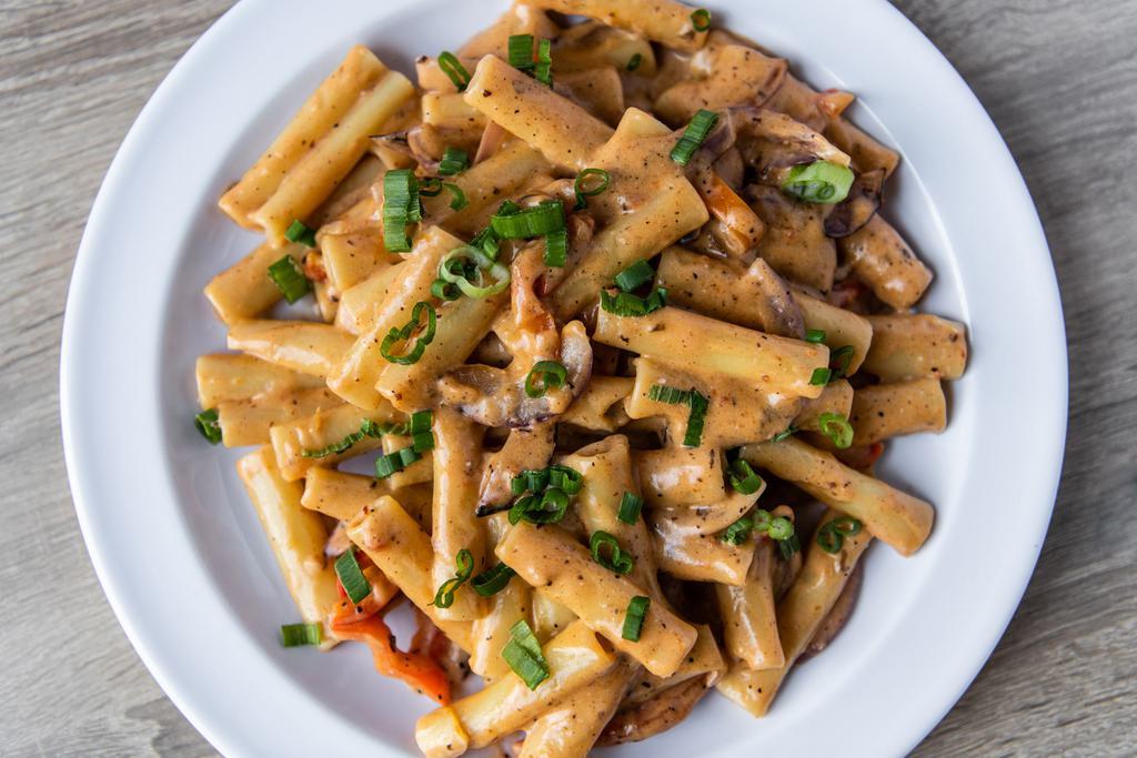 PURPOSE Rasta Pasta  · Sauteed bell peppers and onions, tossed in a jerk alfredo sauce served with ziti pasta 
