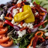 Mediterranean Salad · Blend of mixed greens with chopped cucumber, sliced bell peppers. Sliced red onion, sliced p...
