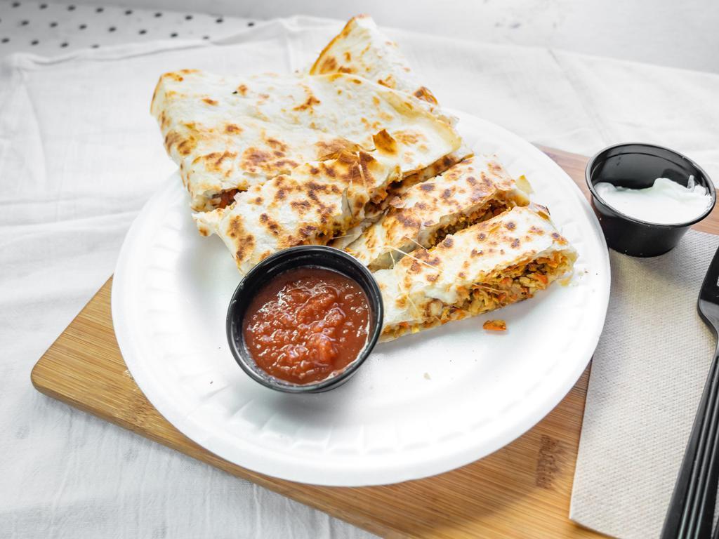 Quesadillas · Cooked tortilla that is filled with cheese and folded in half. 