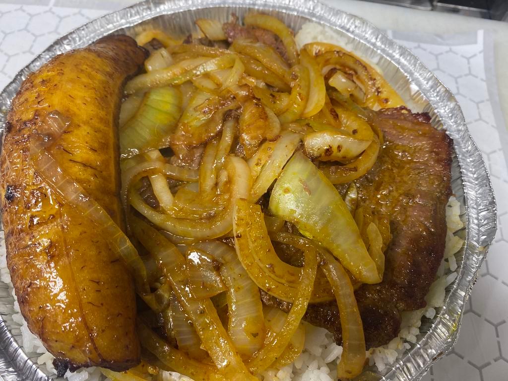 Bistec Encebollado · Steak with onions, rice, beans, and sweet plantain.