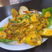 Seafood rice....paella de marisco · Fried rice,shrimp, Calamari, clams, sweet plantains