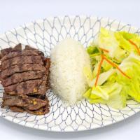 Beef Teriyaki · Marinated thin-sliced beef char-broiled on the grill, topped with teriyaki sauce.