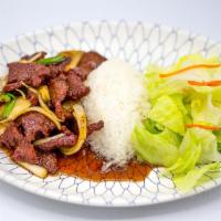 Mongolian Beef · Marinated slices of tenderized beef stir-fried with onions and green onions.