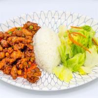 Sweet and Sour Chicken · Deep-fried chicken sauteed in sweet and sour sauce with onions and carrots.