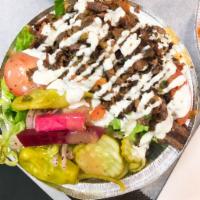 Lamb & Beef Shawarma Large Bowl · Thinly sliced flame roasted lamb & beef. Served with rice, salad (lettuce, pickles, turnip, ...