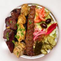 Mix Grill Platter · A taste of three platter entrees. Served with rice, salad (lettuce, pickles, turnip, beets, ...