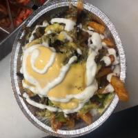 Beef Philly Cheese Large Bowl · Thinly sliced, flame roasted lamb & beef, onion, green peppers, cheese and garlic sauce over...