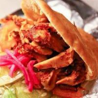 Chicken Shawarma Pita · Thinly sliced flame roasted chicken, lettuce, tomato, pickles, turnips, beets and garlic sau...