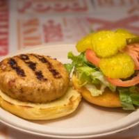 Homemade Chicken Burger · Chicken burger made in house, comes with American cheese, lettuce, tomato, pickles and speci...