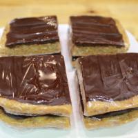 Oatmeal Bars · Delicious oatmeal bars made with peanut butter, coconut, and honey, topped with dark chocola...