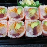 Pink Lady Roll · Tuna, salmon, yellowtail, avocado, crunchy with masago wrapped with pink soy paper. 