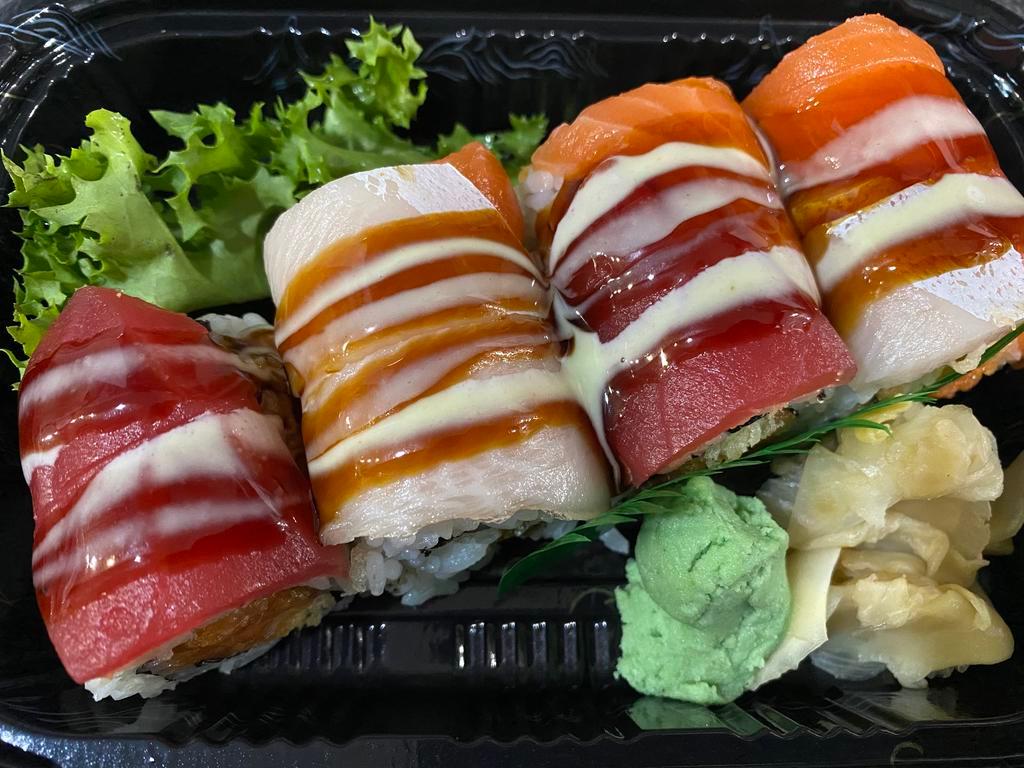 Triple Roll · Spicy crunchy tuna, salmon, yellowtail, top with fresh tuna, salmon, yellowtail with eel sauce and honey wasabi. 