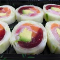 Naruto Roll · Tuna, salmon, yellowtail and avocado wrapped with cucumber paper. 