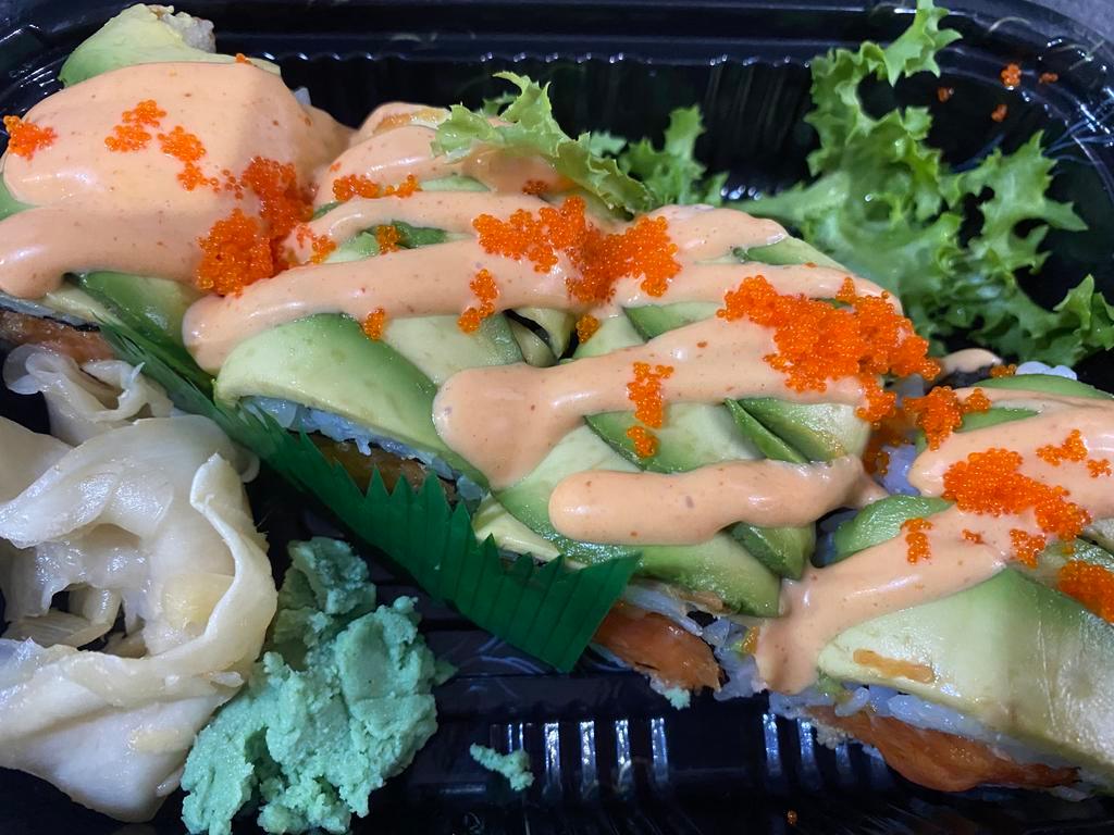 Rocky I Roll · Spicy crunchy tuna topped with sliced avocado, spicy mayo and masago. 