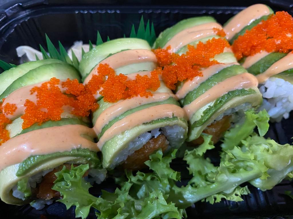 Rocky II Roll · Spicy crunchy salmon topped with sliced avocado, spicy mayo and masago. 