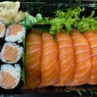 Salmon Boy Entree · 6 pieces of salmon sushi and salmon roll. Served with miso soup or salad. 