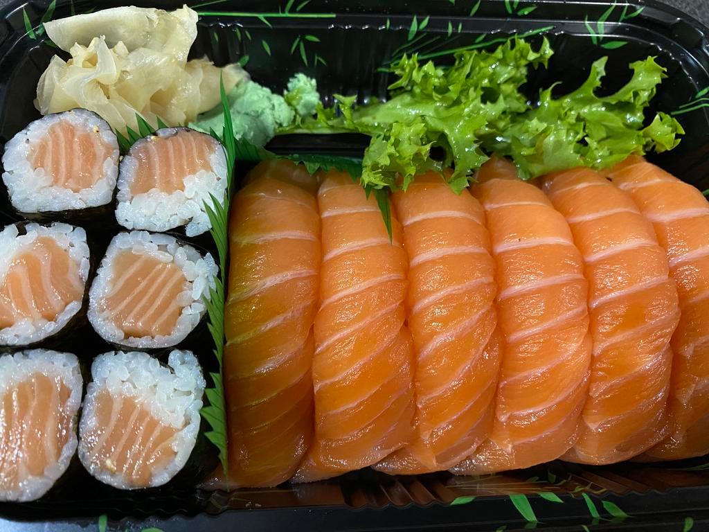 Salmon Boy Entree · 6 pieces of salmon sushi and salmon roll. Served with miso soup or salad. 