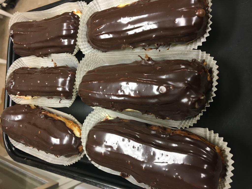 Large Eclairs · Oblong pastry with a custard filling. Frosted with chocolate.