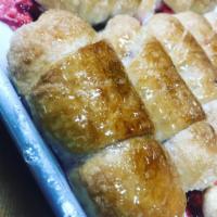 Quesito · Puerto Rican style puff pastry with cream cheese inside.  Baked with a light sugar coating.