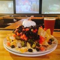 Macho Nacho · Fajita chicken, 3 cheeses, tomatoes, black olives, sour cream and jalapenos. Served with a s...