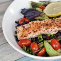 Grilled Salmon Salad · Mesdun greens, cranberries, grape tomatoes, and grilled salmon. Topped with lite lemon dress...