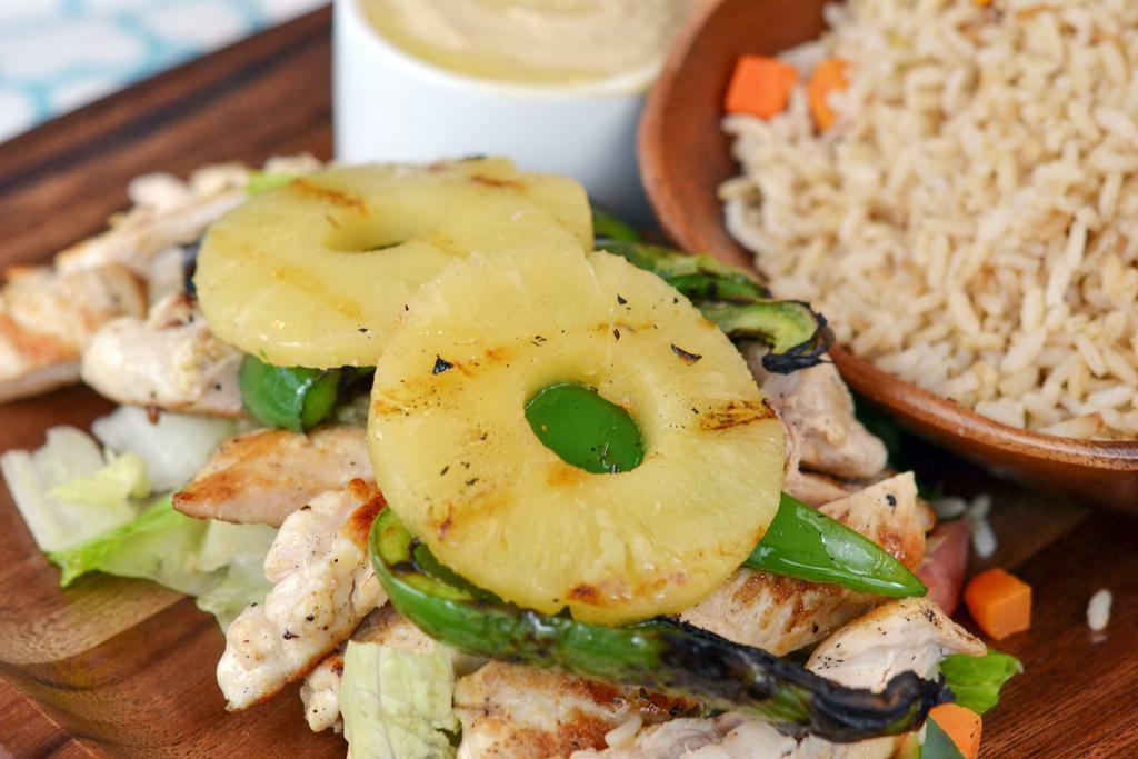 Hawaiian Chicken · Grilled pineapple, caramelized onions and fire roasted vegetables.