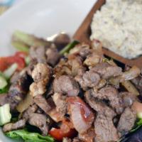 Beef Lamb Shawarma · Our delicious slow roasted beef and lamb with grilled onions and tahini sauce.