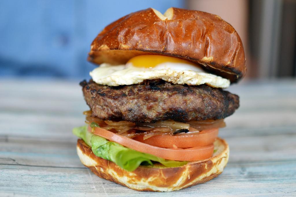 P.G.B. Burger · Sunny-side up egg, grilled onions, tomato, lettuce and our special sauce. Our 100% fresh (never frozen) antibiotic, grass-fed beef perfectly grilled and served on a delicious pretzel bun.