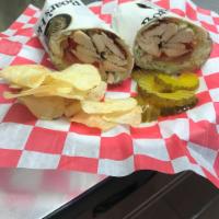 Chicken Club Wrap · Grilled chicken breast, crispy bacon, lettuce, tomatoes, roasted pepper and mayonnaise.