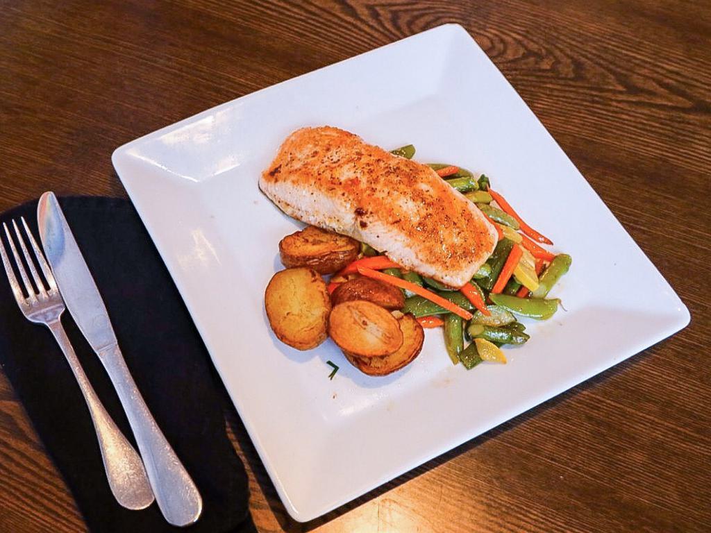 North Atlantic Salmon · Pan-seared salmon topped with a honey-aji amarillo reduction served with baby spinach mashed potatoes and mixed vegetables