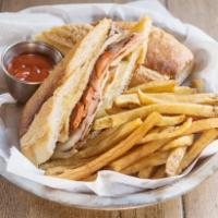 Pressed Cuban Sandwich Done Our Way  · Marinated pork, sliced chorizo, Swiss cheese, pickles and mustard spread. Served with a side...