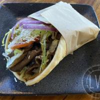 The LVG · beef and lamb, LVG sauce, myzithra cheese, tomato, lettuce, and onion.