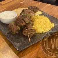 Souvlaki on Rice · Two skewers of your choice cooked on an open flame.
Served with saffron rice, pita bread, an...
