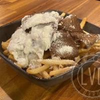 Gyro Fries · Skinny cut fries topped with gyro slices, tzatziki, and feta cheese