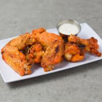 Baked Buffalo Wings · Served with celery and a dressing.