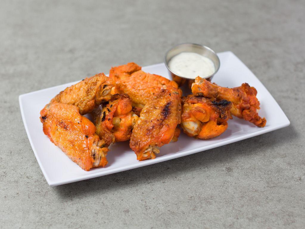 Baked Buffalo Wings · Served with celery and a dressing.