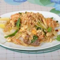 T5. Pad Thai Deluxe · Served with Thai noodles. Chicken, pork, shrimp and vegetable.