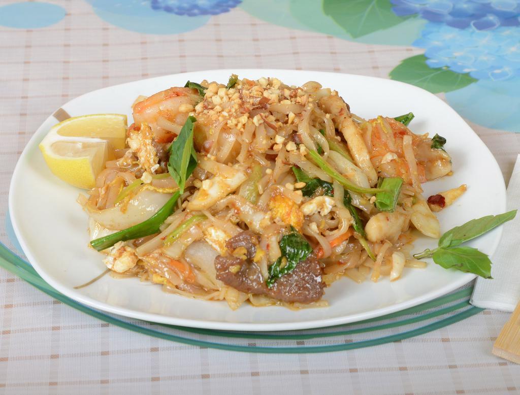 T5. Pad Thai Deluxe · Served with Thai noodles. Chicken, pork, shrimp and vegetable.