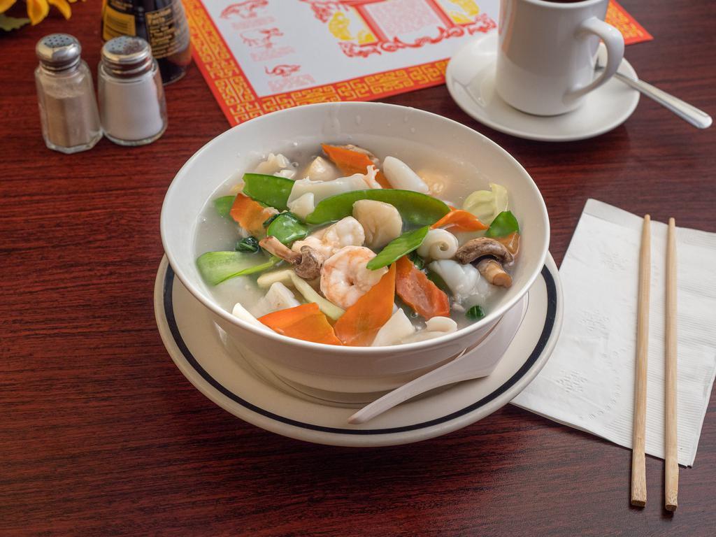 Seafood Combination Udon Soup · Shrimp scallops and calamari mix vegetable with udon noodles.